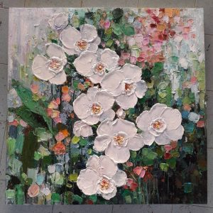 White flower in green background